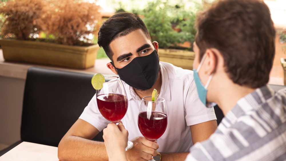 Couple wearing masks at a restaurant