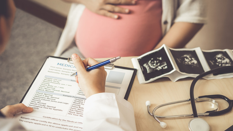 Pregnant woman and her doctor