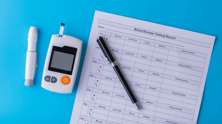 Blood glucose monitor and paper record