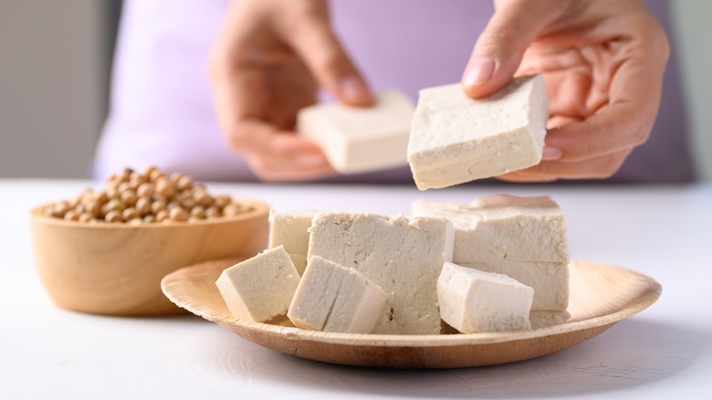 woman preparing tofu