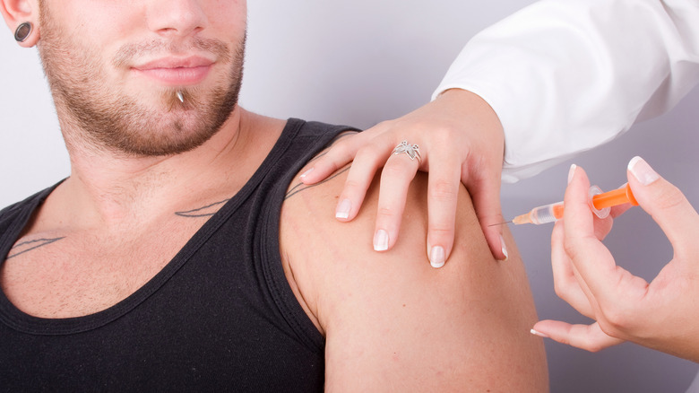 Man getting COVID-19 vaccine