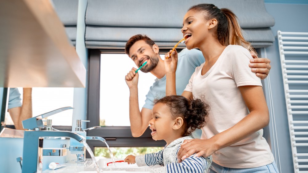 Family brushing teeth