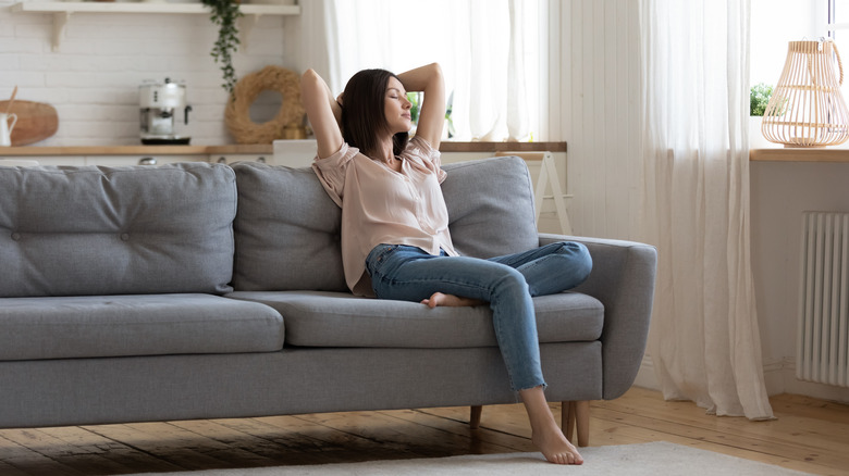 a woman relaxing on the couch 