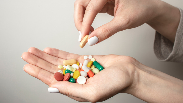 multiple pills in a hand