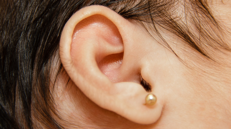 Close up image of baby with ear pierced