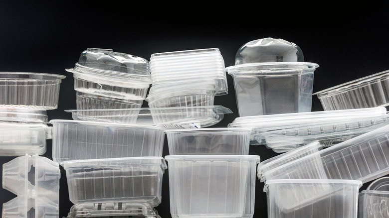 Plastic takeout containers with black background