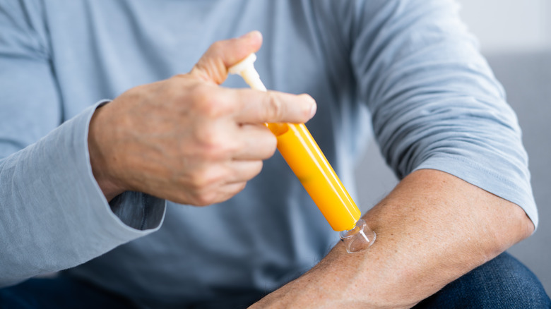 Man using venom suction device