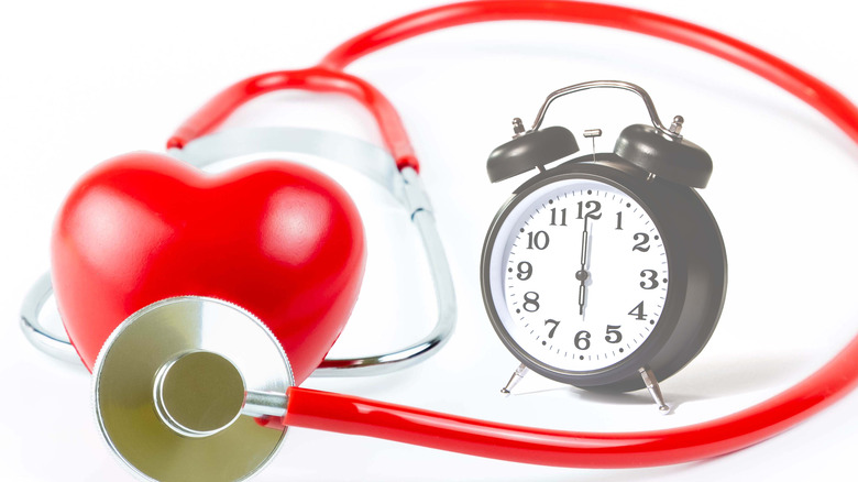 heart with stethoscope and clock