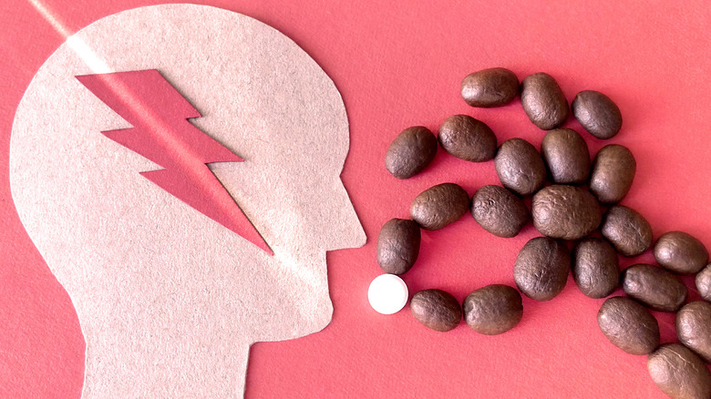 coffee beans shaped into hand feeding a pill to mouth