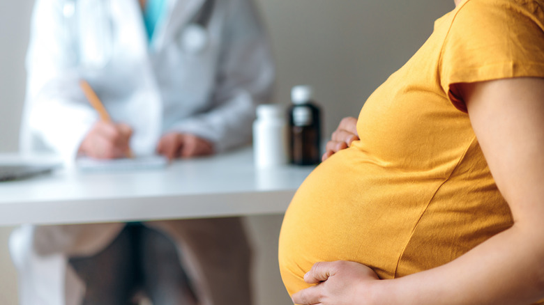 pregnant woman at doctor's surgery