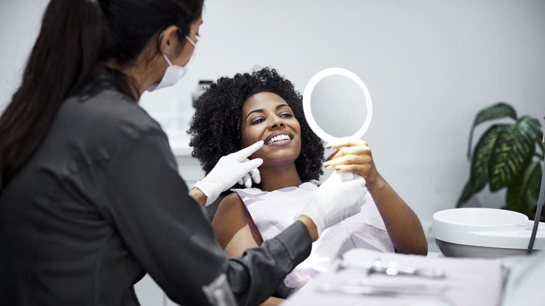 Smiling woman in dentist office