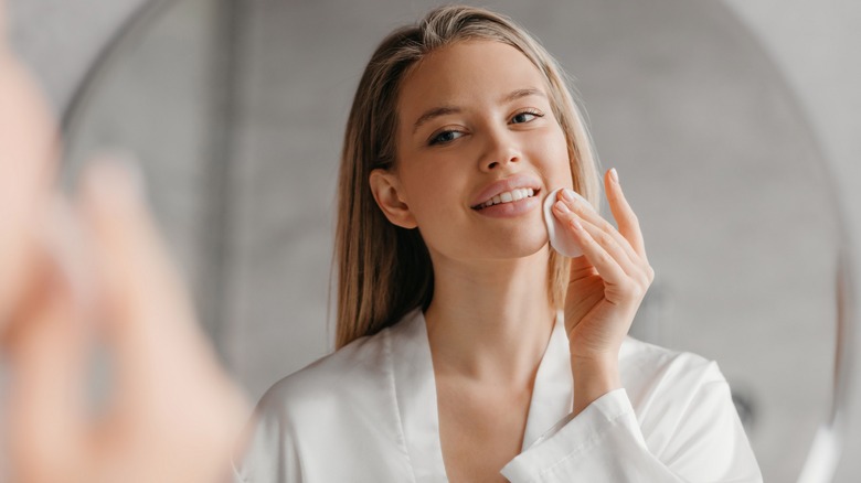 woman using cotton pad