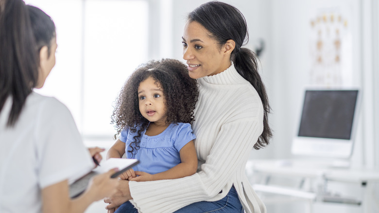 Mother and daughter at doctor's appointment