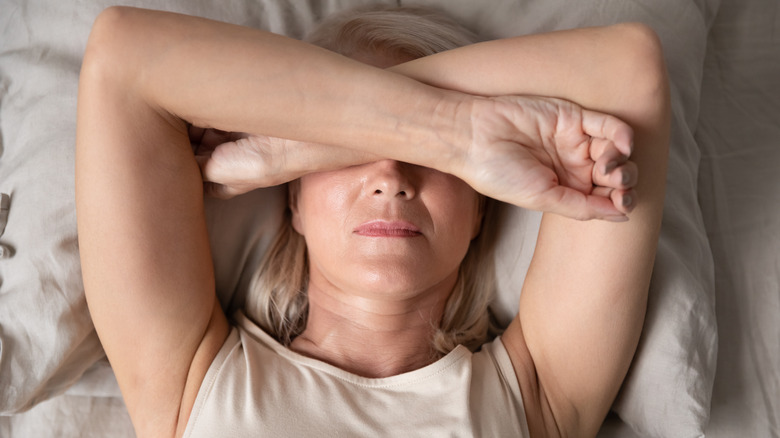 Woman lying in bed