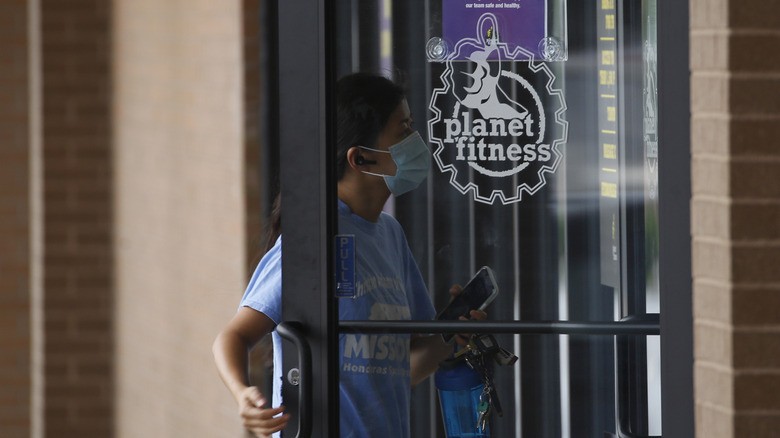 woman entering Planet Fitness