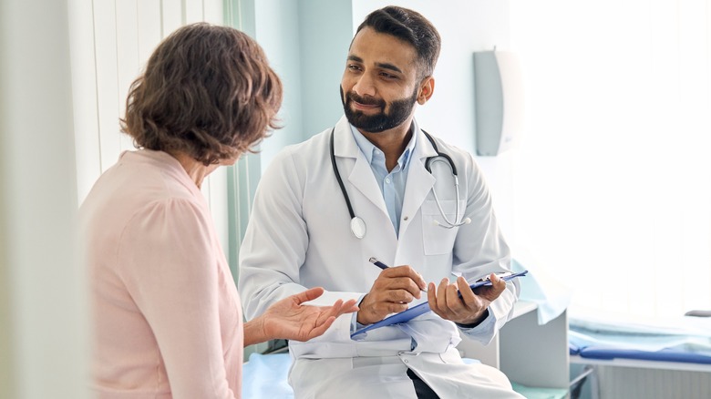 Woman speaking with doctor