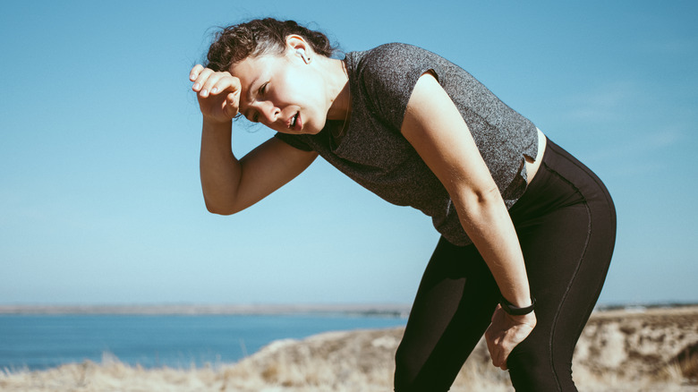 woman dizzy while working out