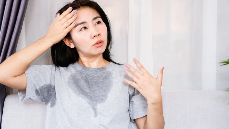 woman perspiring through shirt