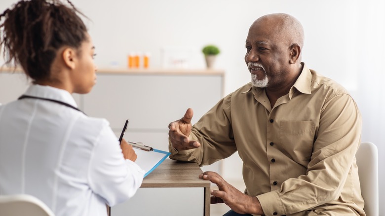 man talking to doctor