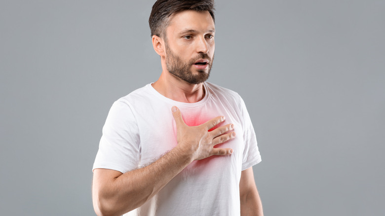 young man with hand on heart