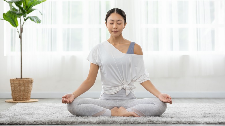 woman practicing yoga