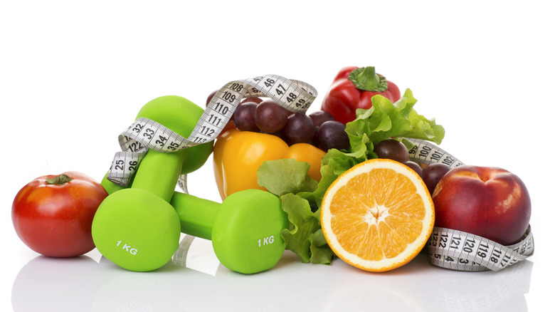 healthy foods and dumbbells