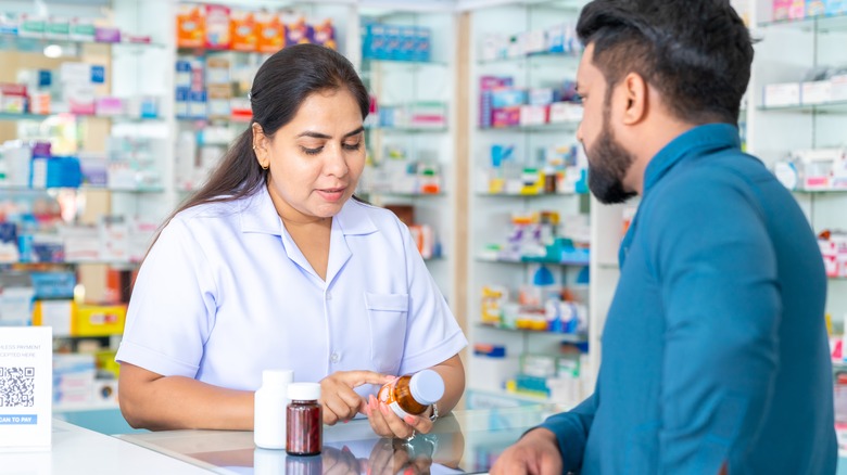 pharmacist talking to customer