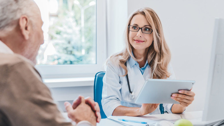 A doctor speaks with a patient