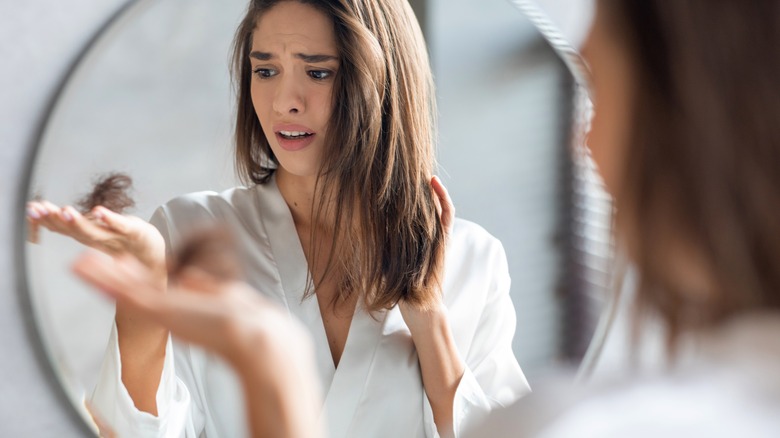 woman noticing lost hair