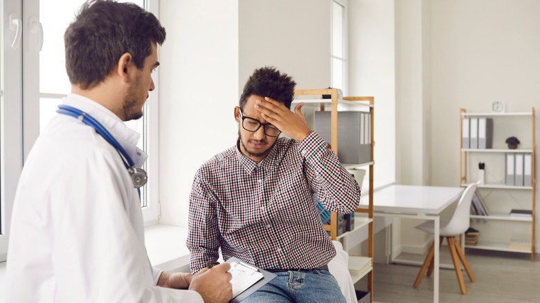 Patient with headache and doctor