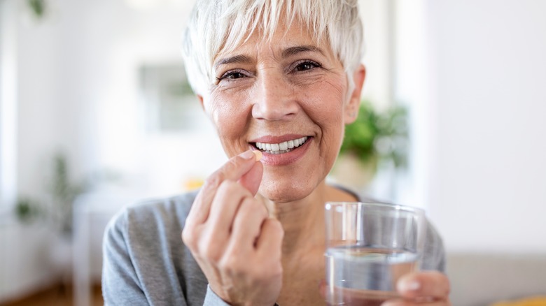 woman taking medication