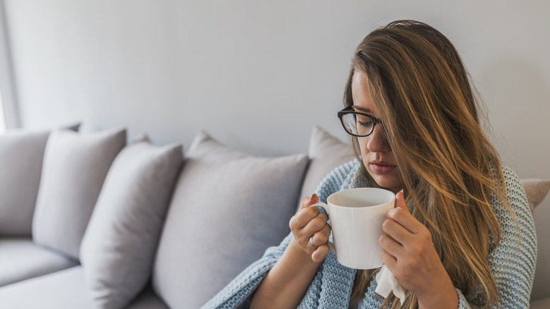 Woman with cold hydrating 