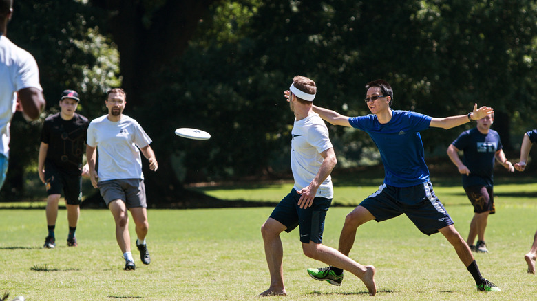 Two teams playing ultimate frisbee