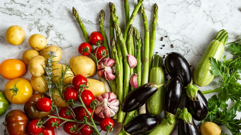 an assortment of vegetables laid out on a table