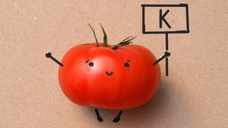 tomato caricature holding potassium sign 