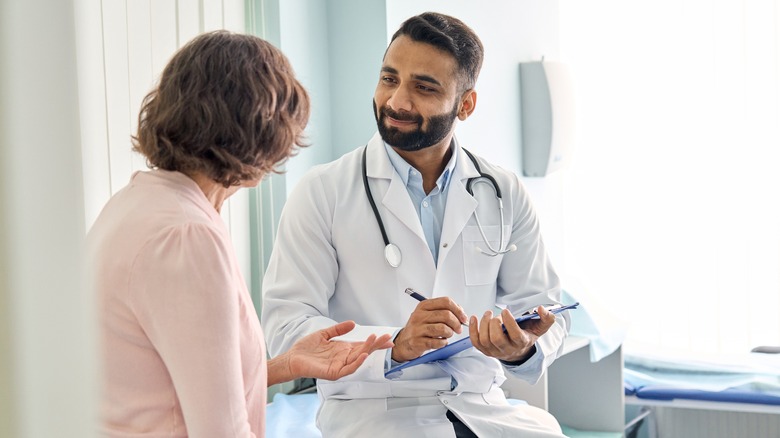 Patient consulting with doctor