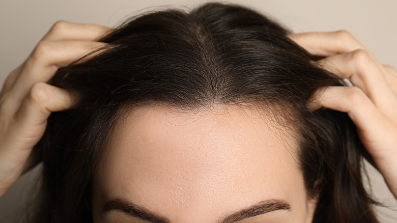 Woman touching her hair