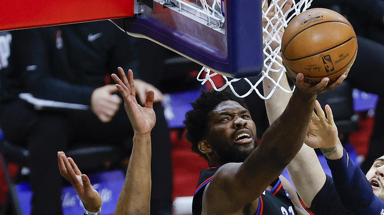 Joel Embiid of 76ers shooting basket