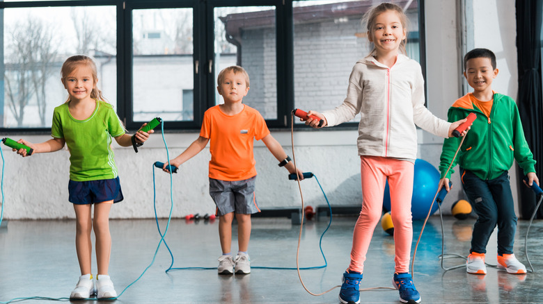 children jumping rope in a gym