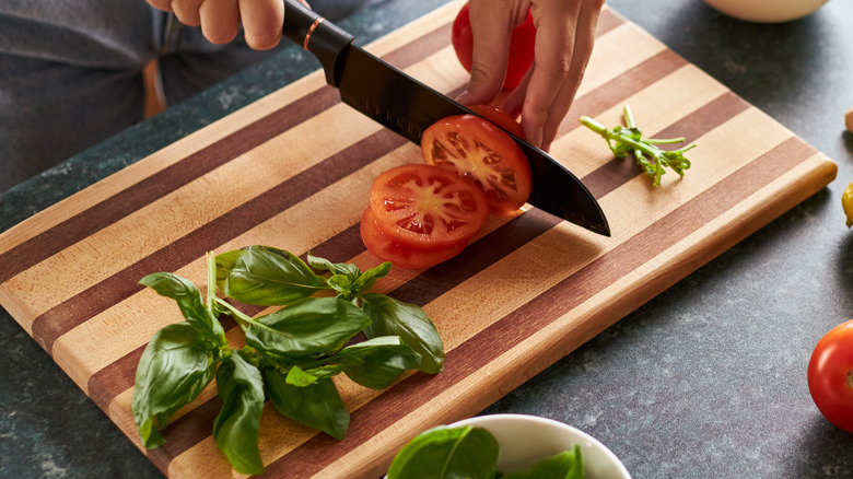 wooden chopping block with chopped vegetables