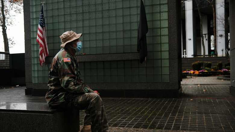 Veteran sitting at the Vietnam Veteran's Memorial