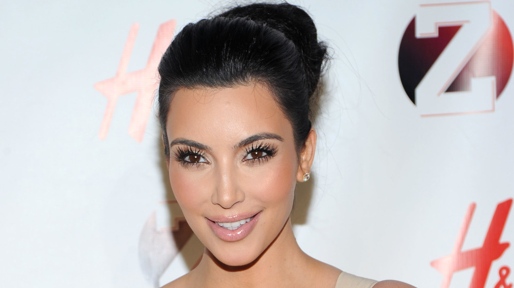 Kim Kardashian smiling on the red carpet