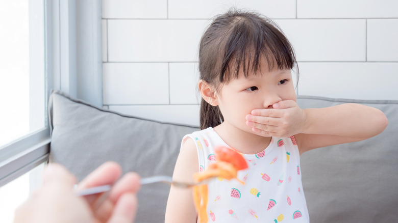 little girl refusing food