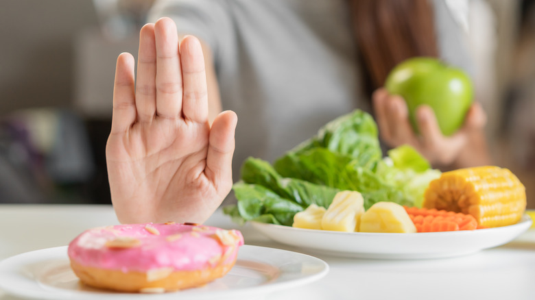 person eats healthy, refuses donut