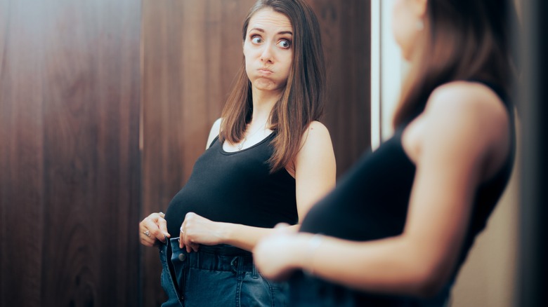 Jeans don't fit pregnant woman