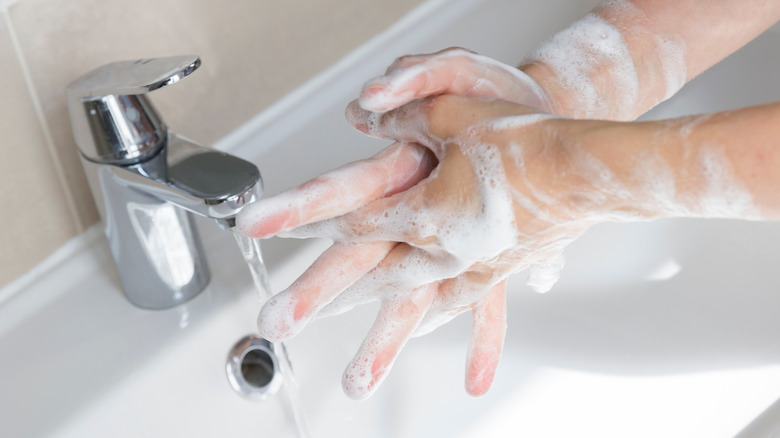 person washing hands