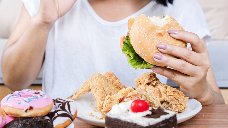 woman eating large amount of food