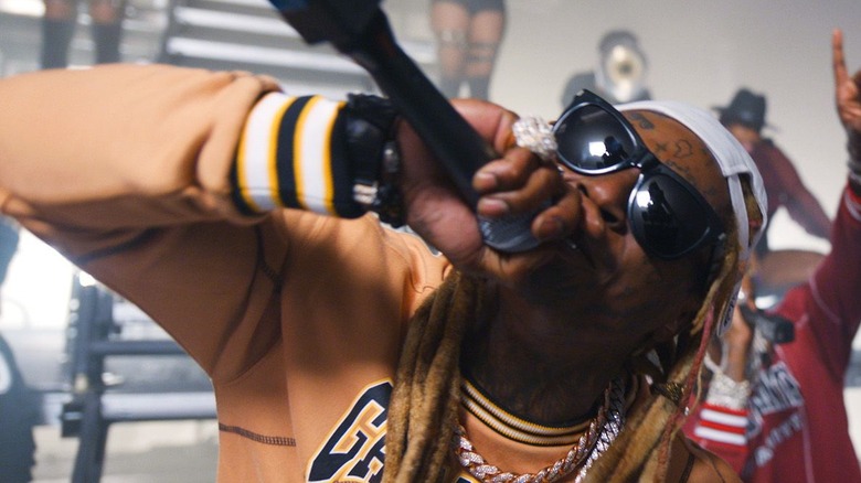 Lil Wayne performing in shades