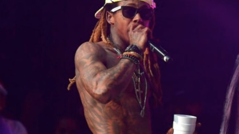 Lil Wayne performing with a "double cup"