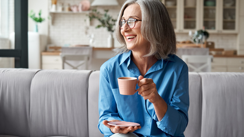 A woman enjoys a cup of coffee